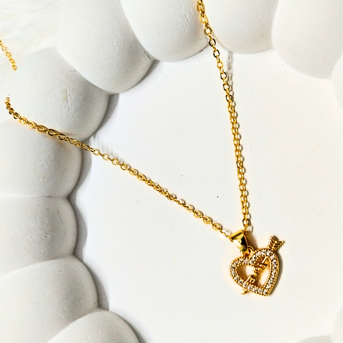 Gold heart pendant love necklace with arrow charm and crystal accents