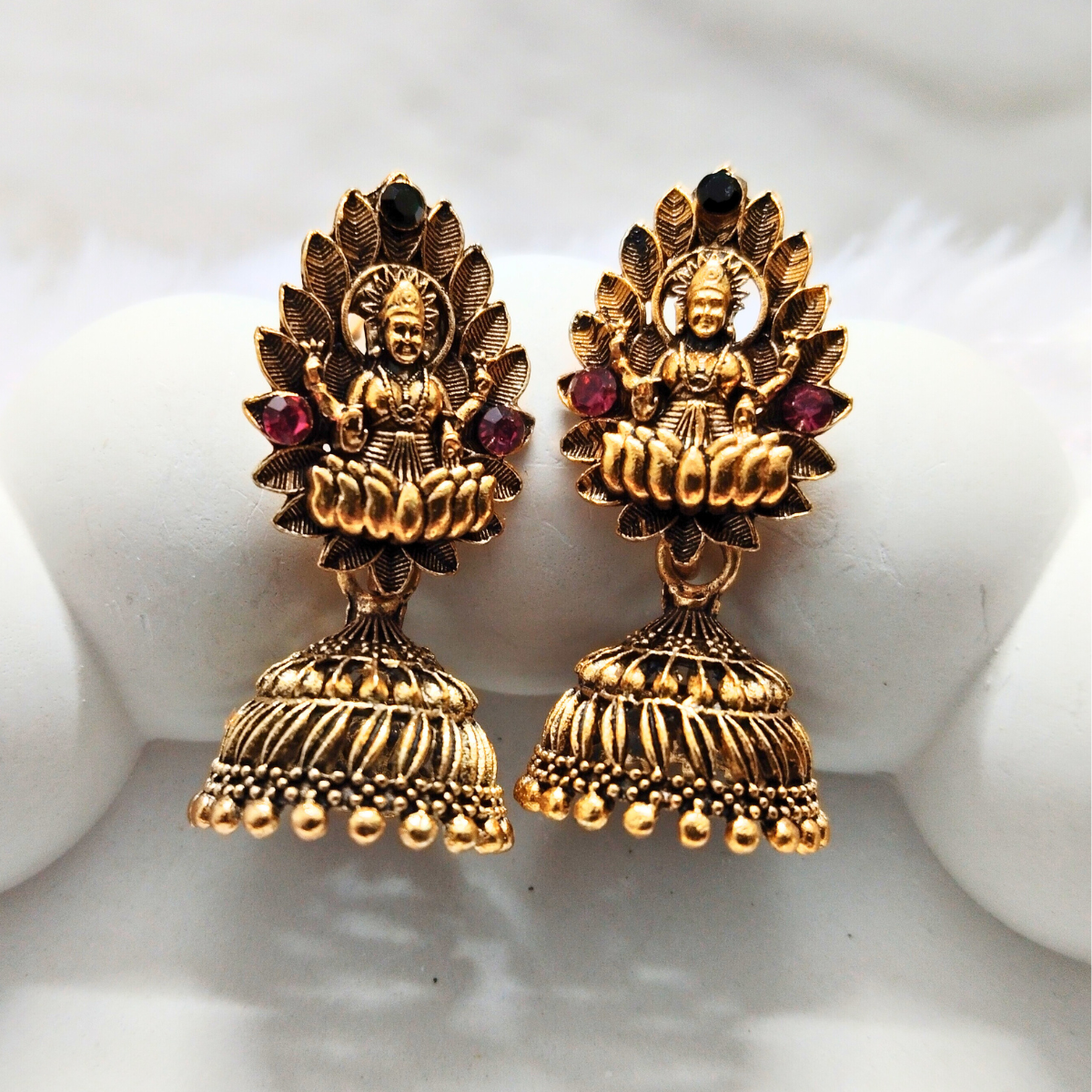 Antique gold Lakshmi temple jhumka earrings with ruby stone accents and traditional ghungroo detailing