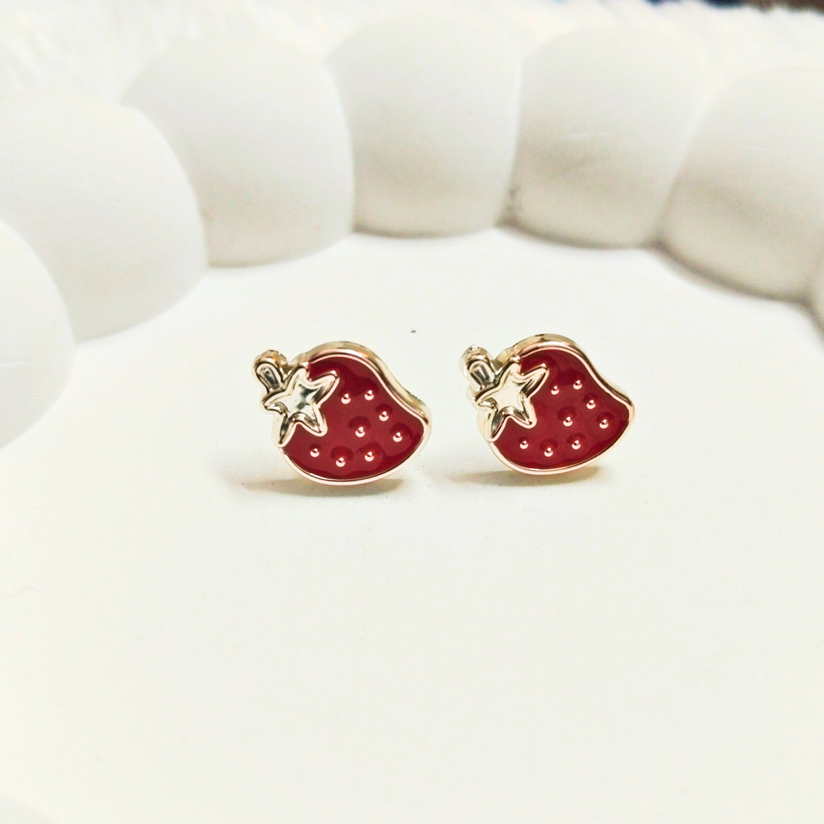 Adorable red strawberry earrings with tiny star detail