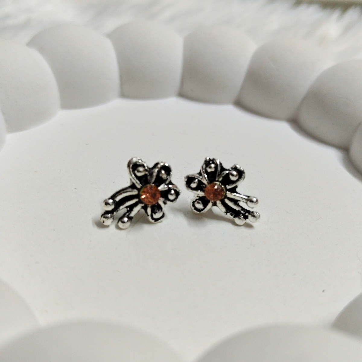 Vintage floral stud earrings with orange gemstone in antique silver finish