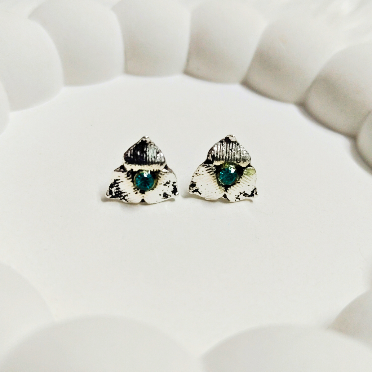 Vintage petal stud earrings with teal gemstone and antique silver texture