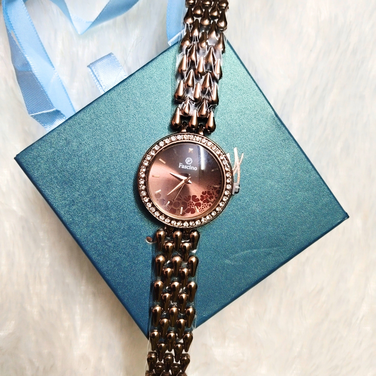 Rose gold drop design women's watch with linked bracelet and crystal dial