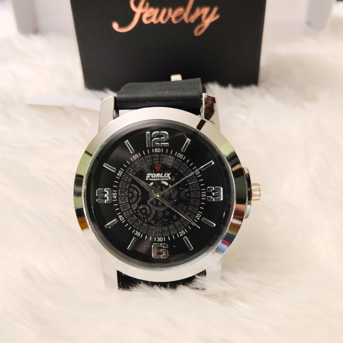 Men’s analog wristwatch with black rubber strap and black dial front view